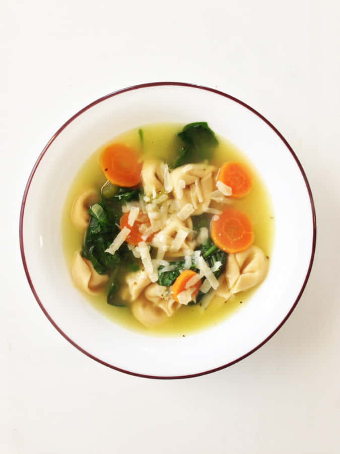 Delicate Tortellini In Brodo With Carrots And Spinach Wallpaper