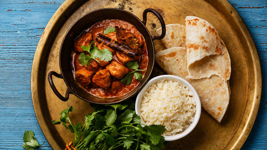 Delightful Chicken Tikka Masala With Flat Bread - Authentic Indian Cuisine Wallpaper
