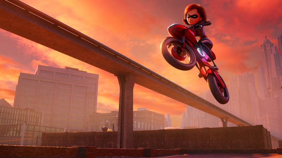 Elastigirl Displaying Her Superpower On A Motorcycle Wallpaper