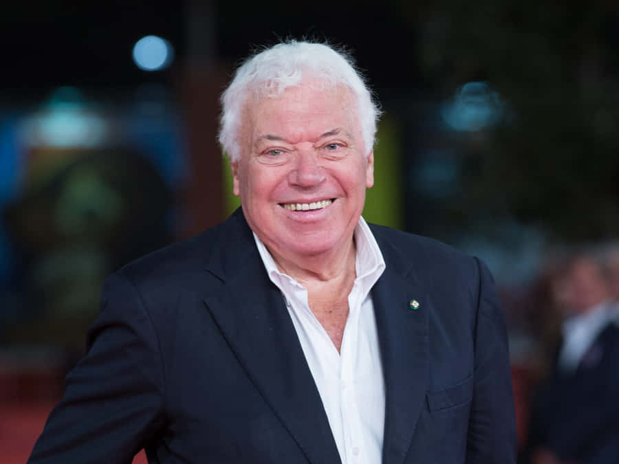 Elderly_ Gentleman_ Smiling_at_ Event Wallpaper