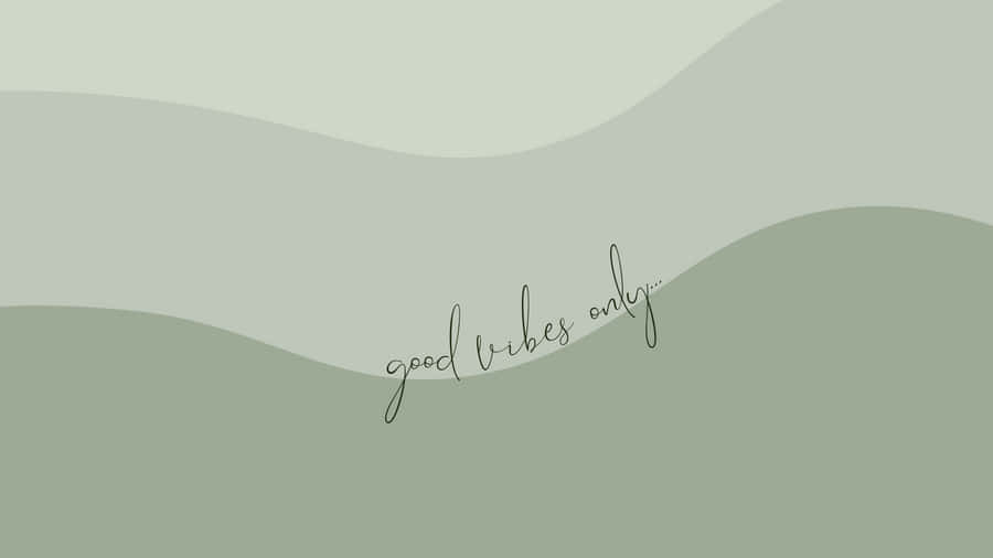 Elegant Sage Green Laptop On A Minimalist Desk Setup Wallpaper