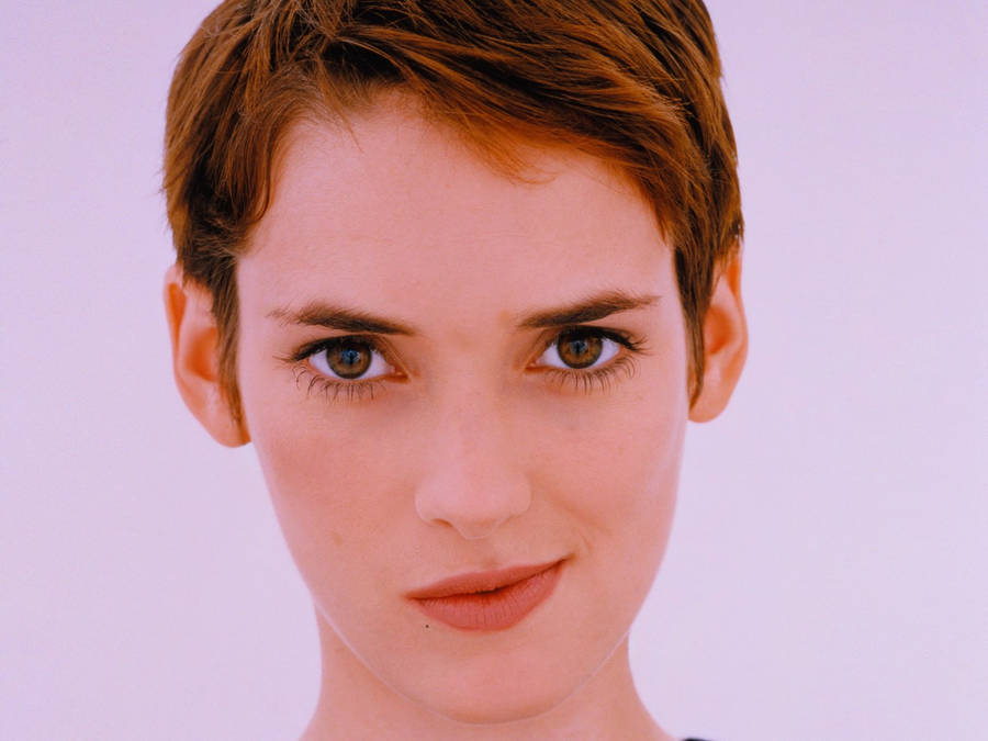 Elegant Winona Ryder Sporting A Chic Pixie Cut. Wallpaper