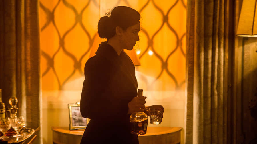 Elegant Woman Holding Decanter4 K Wallpaper