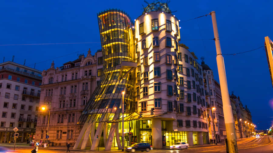 Enchanting Night View Of Dancing House In Prague Wallpaper