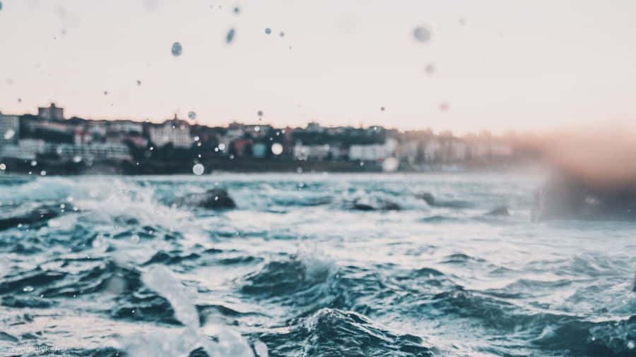 Enjoy A Beautiful Day By The Beach On Your Laptop. Wallpaper