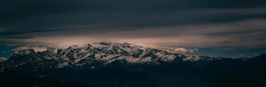 Enjoy The Magic Of Disney On Two Screens Wallpaper