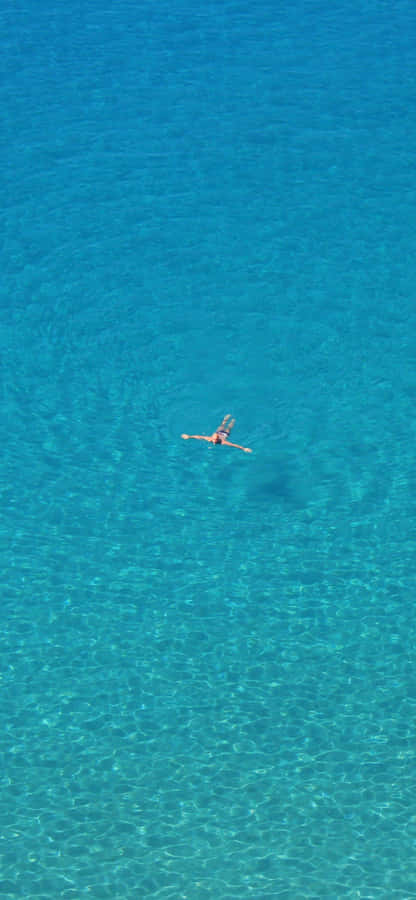 Enjoy The Modern Look Of A Blue Iphone With Simple Details Wallpaper