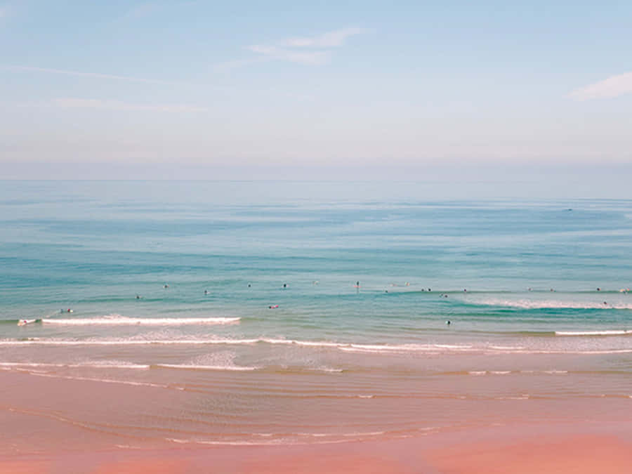 Enjoy The Pink Ocean Horizon For A Peaceful Beach Aesthetic Wallpaper