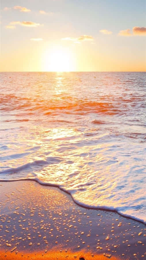 Enjoy The Sunrise Along The Deserted Shore Wallpaper