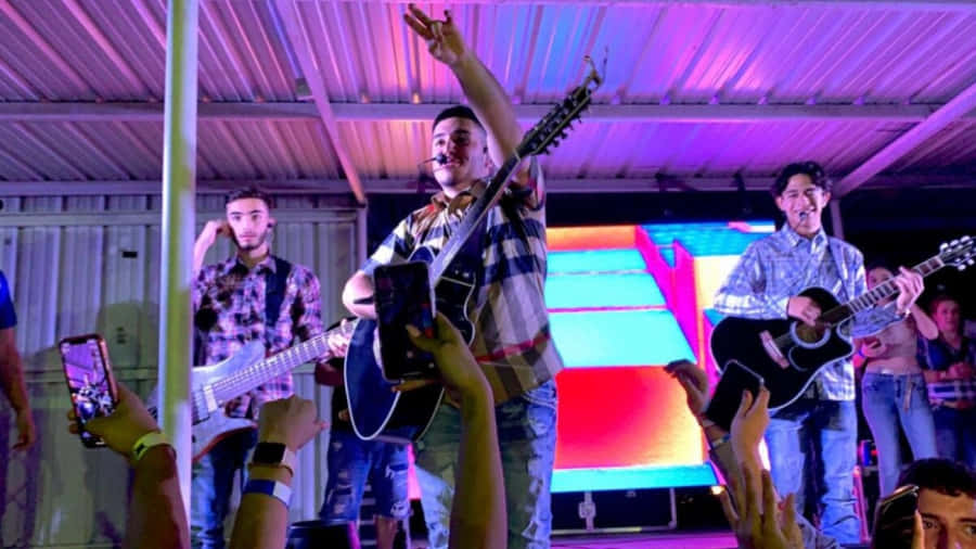 Eslabon Armado Performing On Stage Wallpaper