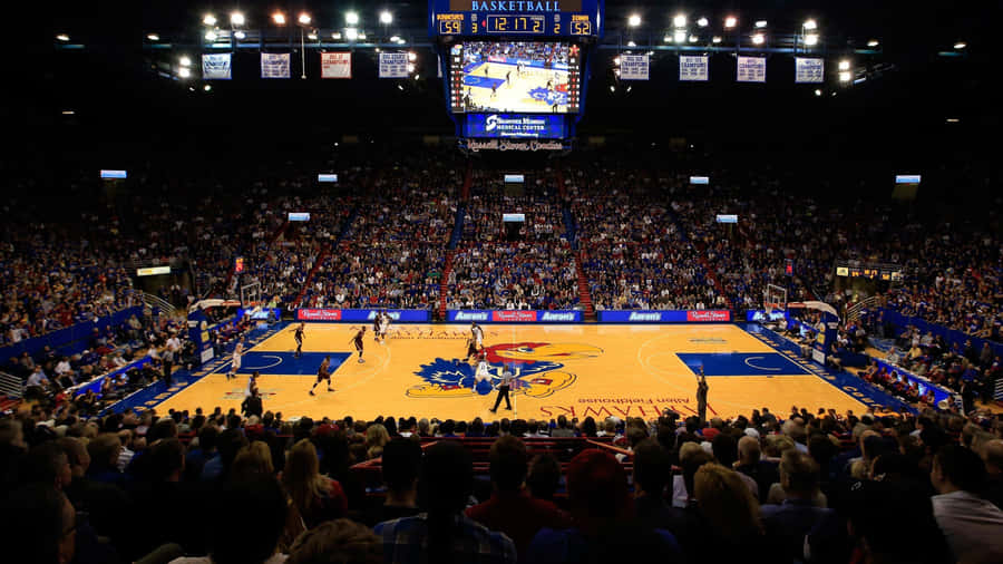 Experience Pure Jayhawk Excitement As The University Of Kansas Takes On Their Opponents! Wallpaper
