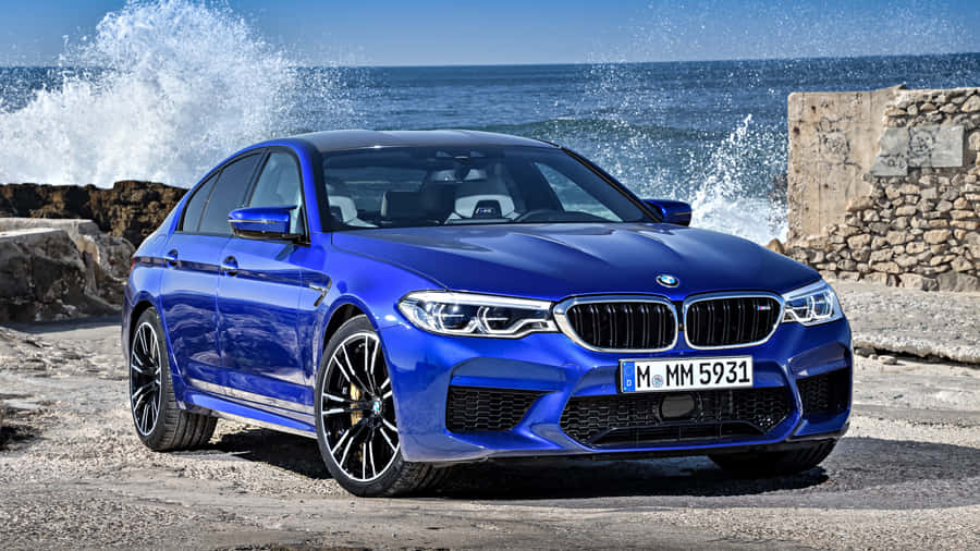 Experience The Luxury Of Driving The Bmw M5 Wallpaper