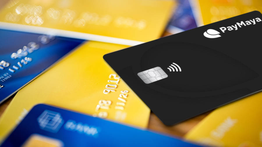 Exquisite Paymaya Credit Card Displayed On A Pile Of Cards Wallpaper