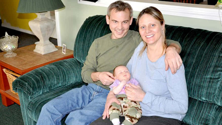 Family Couch Portraitwith Newborn Wallpaper