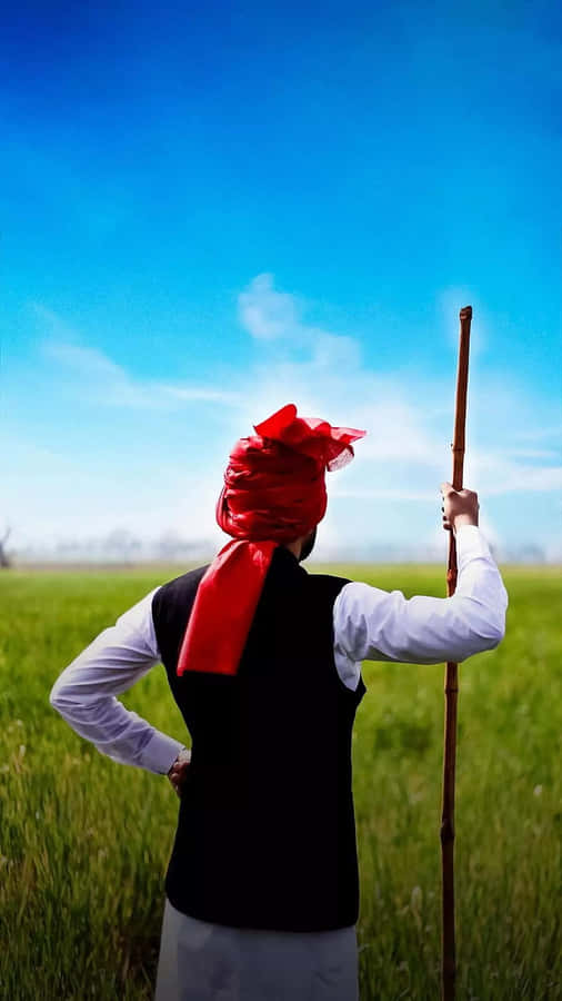 Farmer_ Gazing_ Over_ Fields.jpg Wallpaper