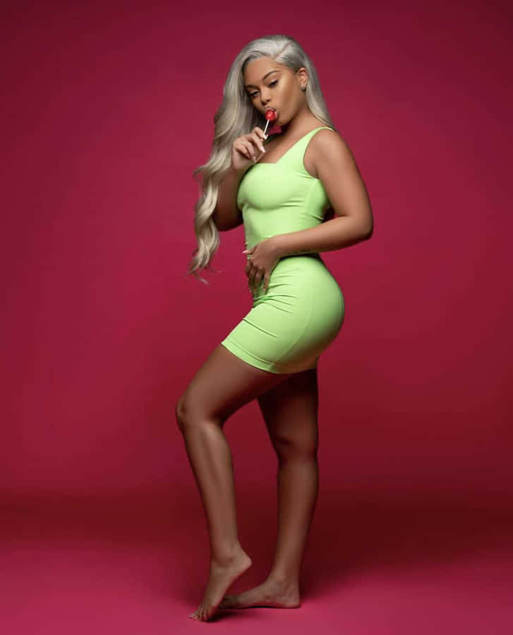 Fashionable_ Woman_in_ Lime_ Dress Wallpaper