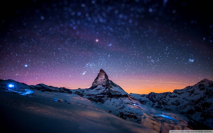 Feel The Majesty Of Nature At Night On A Mountain Wallpaper