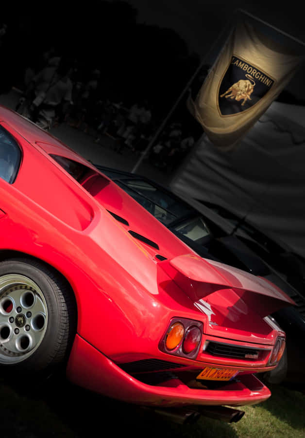 Feeling The Wind In Your Hair While Driving A Classic Ferrari Wallpaper