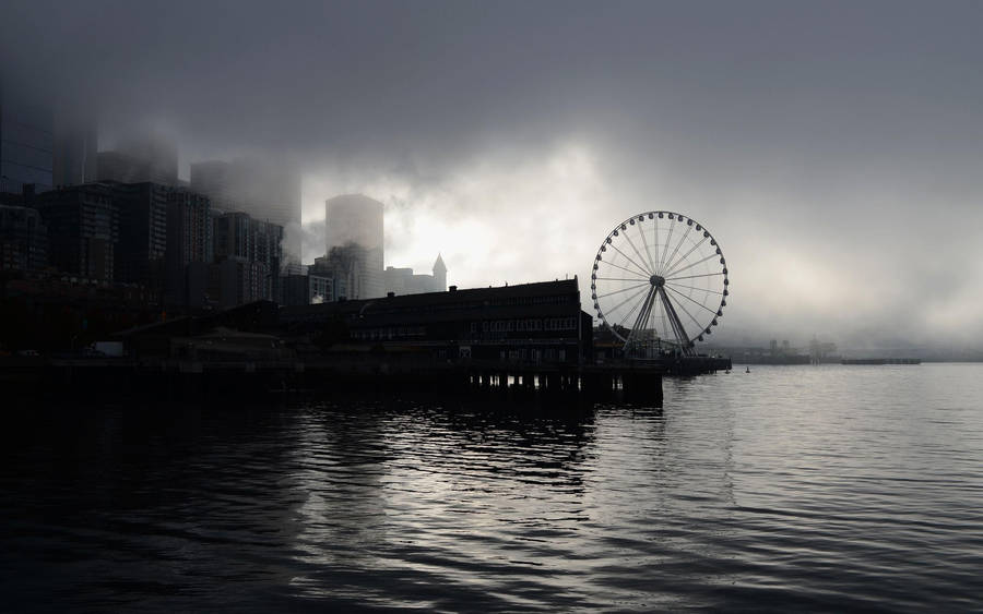 Ferris Wheel Under Gloomy Sky Wallpaper