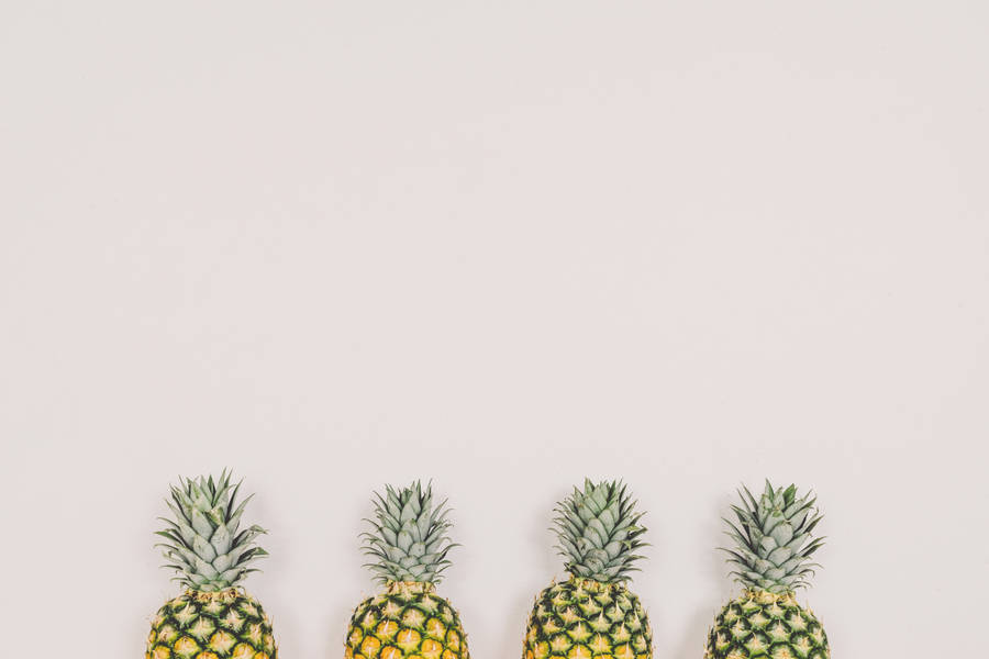 Four Pineapples On White Background Wallpaper
