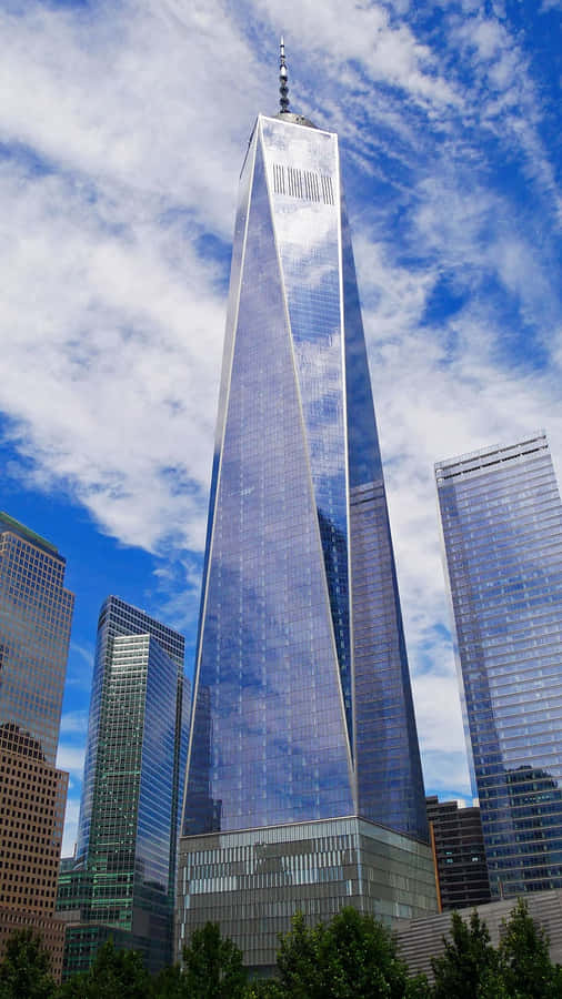 Freedom Tower With Blue Cloudy Sky In New York City Wallpaper