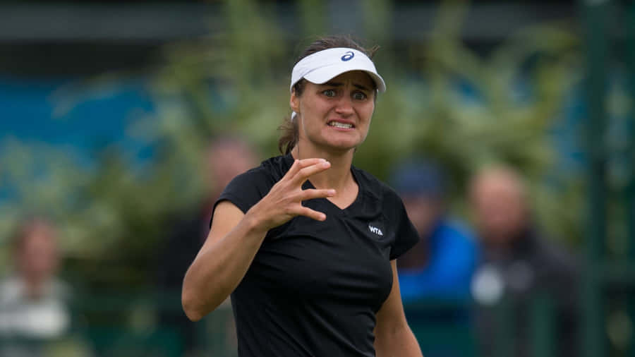 Frustrated Monica Niculescu Wearing Black Wallpaper