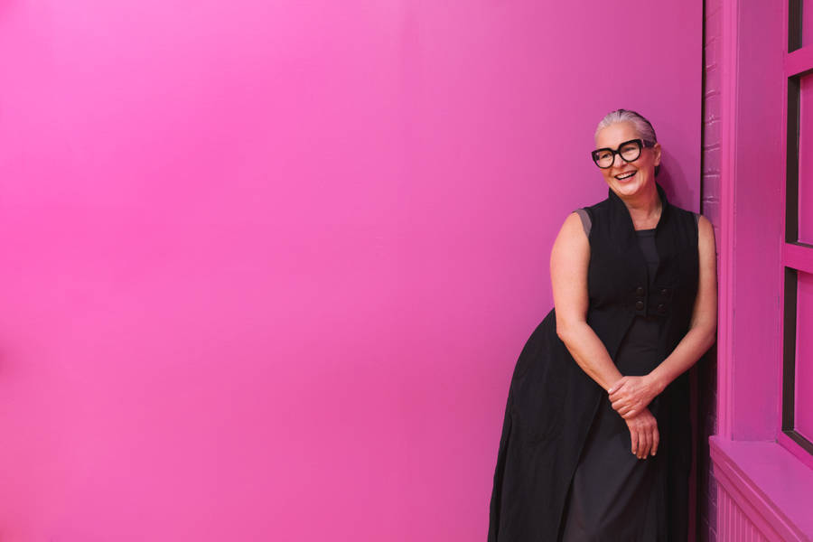 Fuchsia Pink Wall With Woman Posing Wallpaper