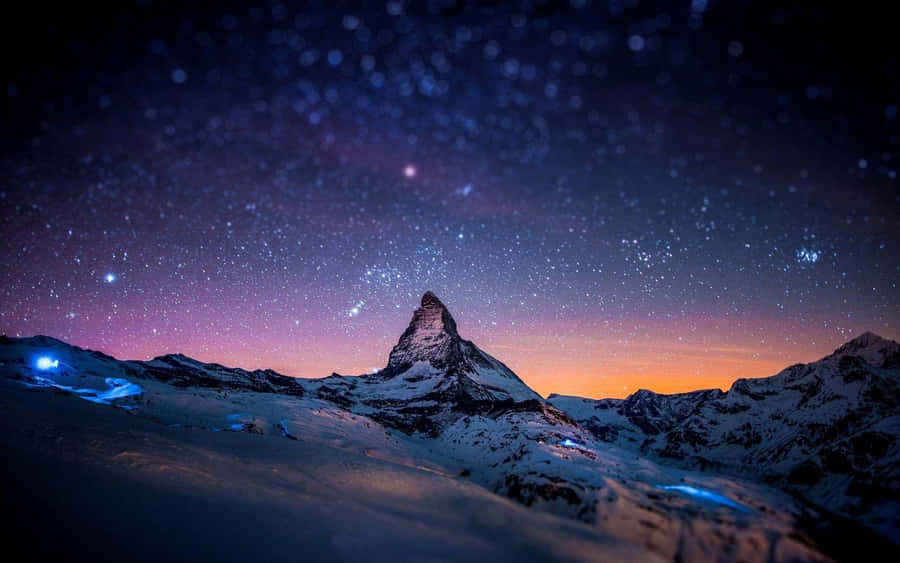 Gazing Into The Beauty Of A Star-filled Night Sky. Wallpaper