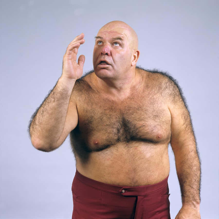 George Steele Wearing Maroon Trouser Wallpaper