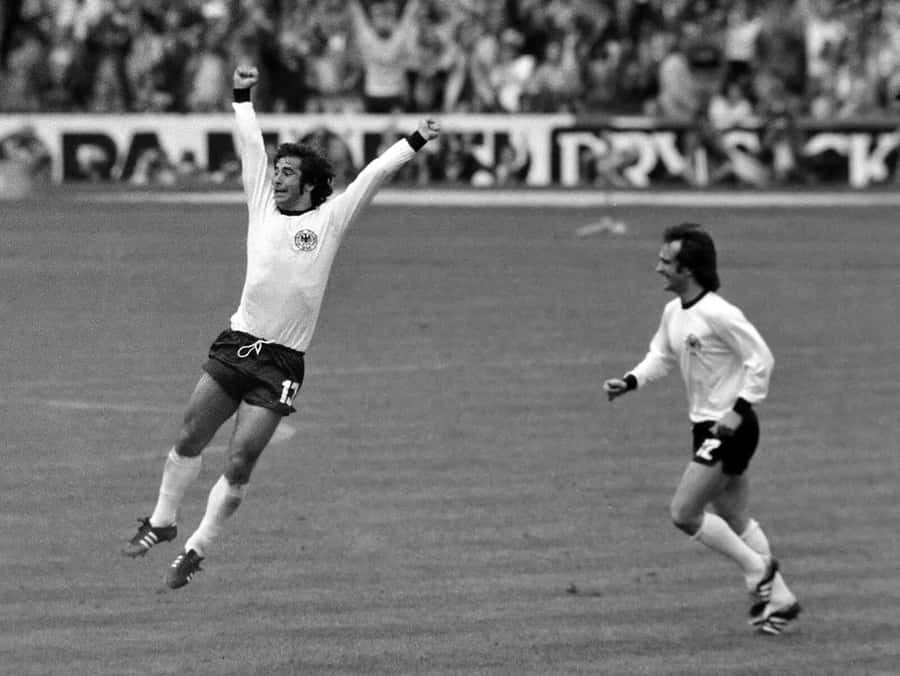 Gerd Muller And Franz Beckenbauer Celebrating Wallpaper