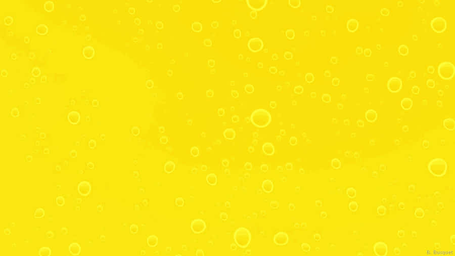 Get Your Work Done In Style With A Pastel Yellow Laptop Wallpaper