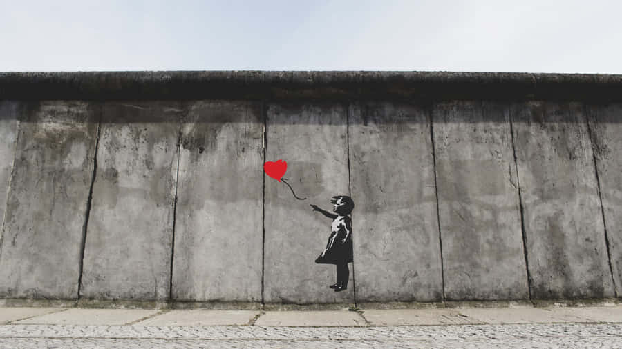 Girl With Balloon In Berlin Wall Wallpaper