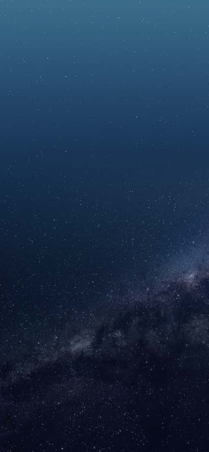 Glittering Blue Stars Shining Brightly Against A Night Sky. Wallpaper