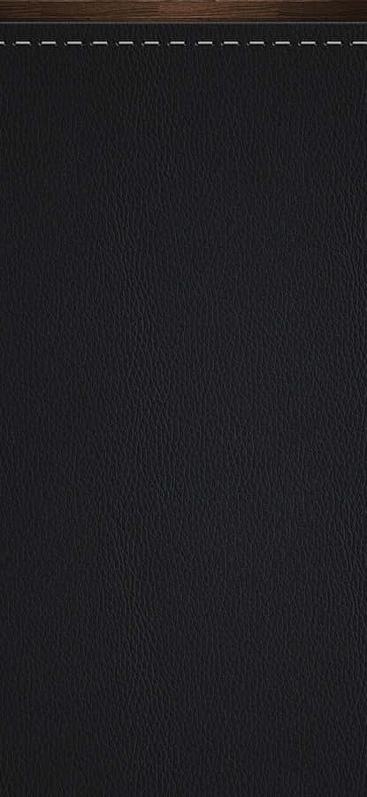 Glossy Black Leather Fabric That Shines As It Catches The Light Wallpaper
