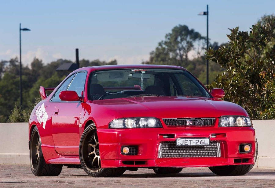 Glossy Red Nissan Skyline Gtr R33 Wallpaper