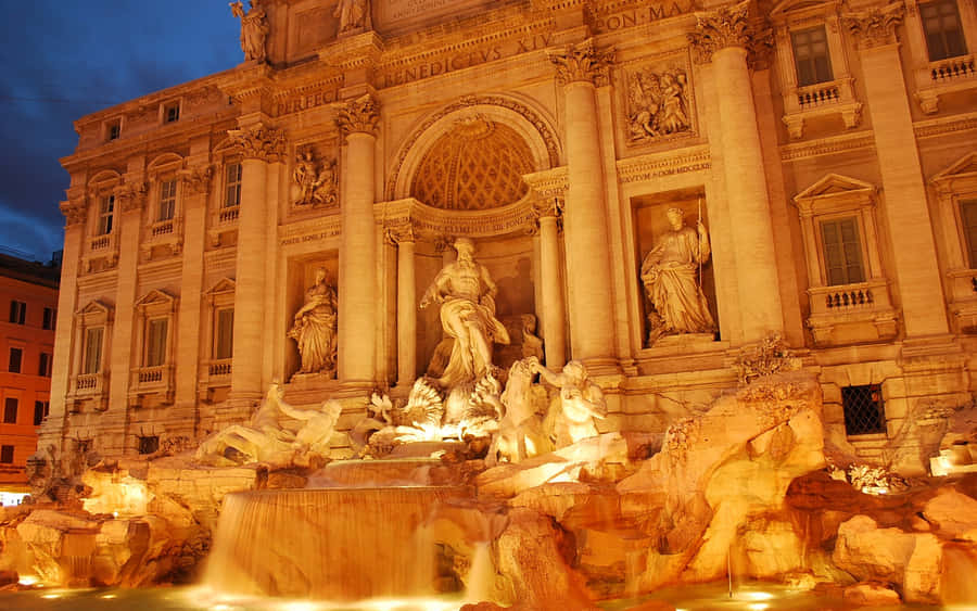 Glowing Gold Spotlight On Trevi Fountain Wallpaper