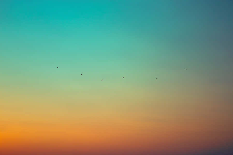 Gradient Orange And Teal Sunset Wallpaper