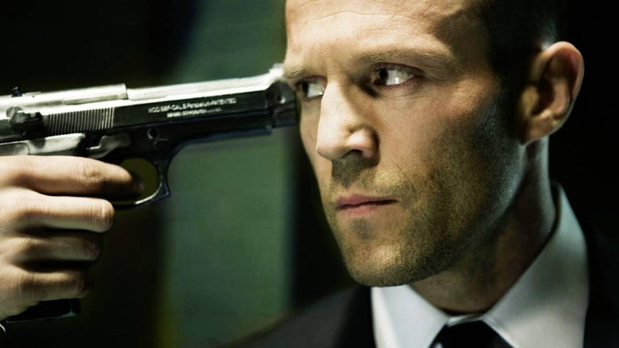 Gun Pointing To Jason Statham Wallpaper