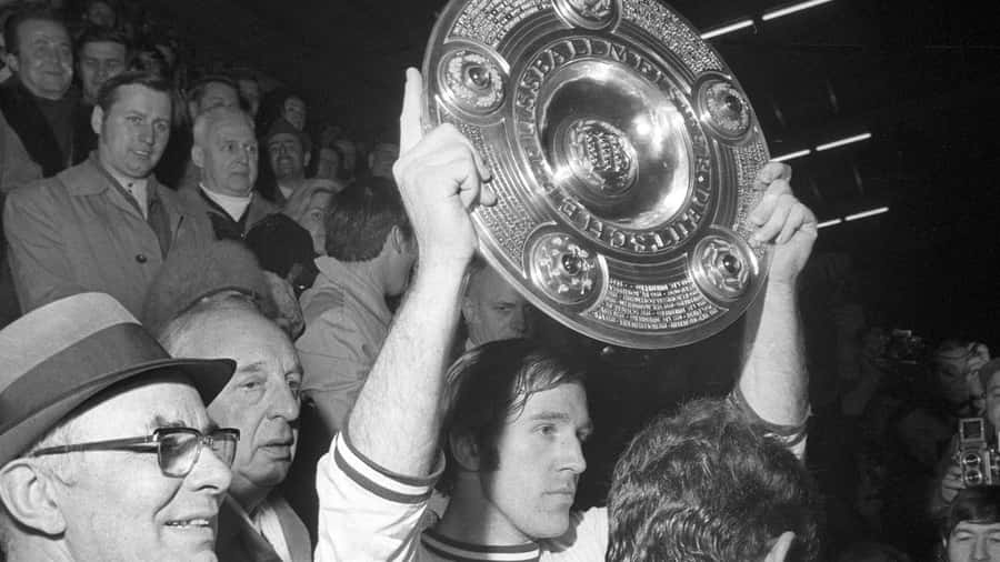 Gunter Netzer Celebratingwith Trophy Wallpaper