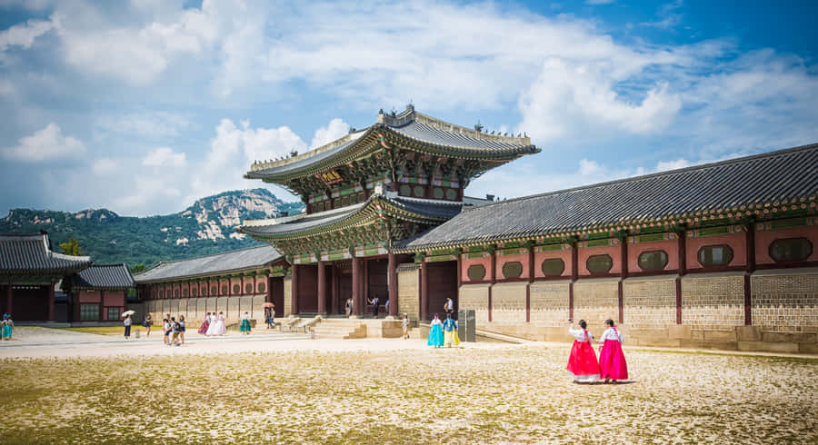 Gyeongbokgung Palace Tourists In Traditional Clothing Wallpaper