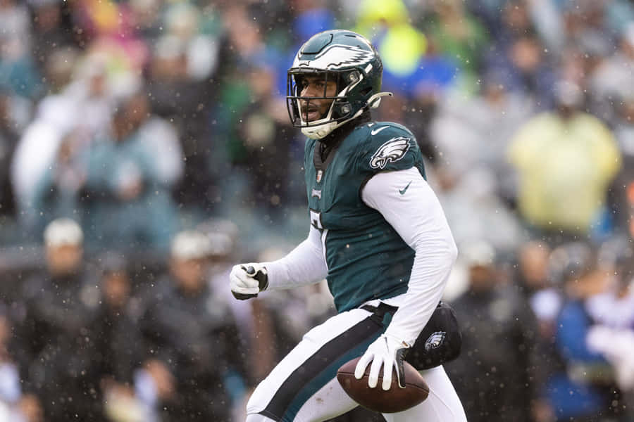 Haason Reddick Showing His Strength On The Field. Wallpaper