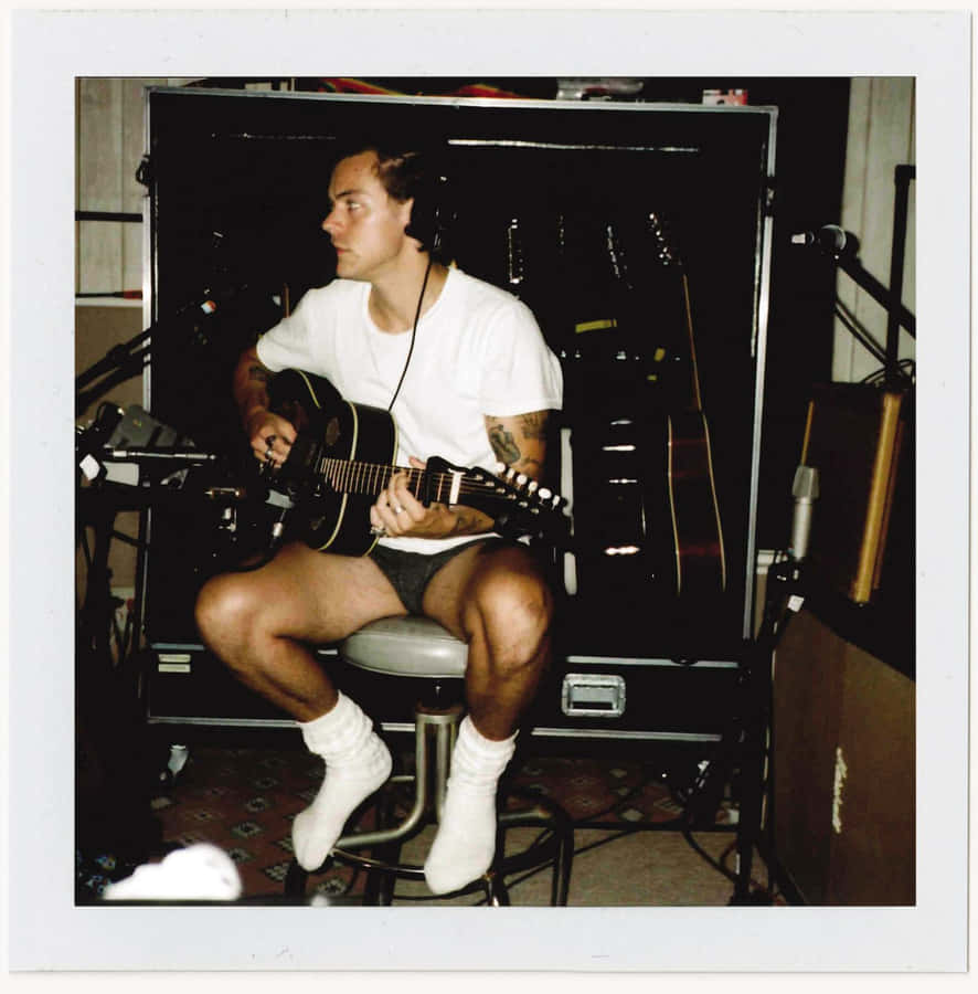 Harry Styles Looking Suave On His Self-titled Album Cover Wallpaper