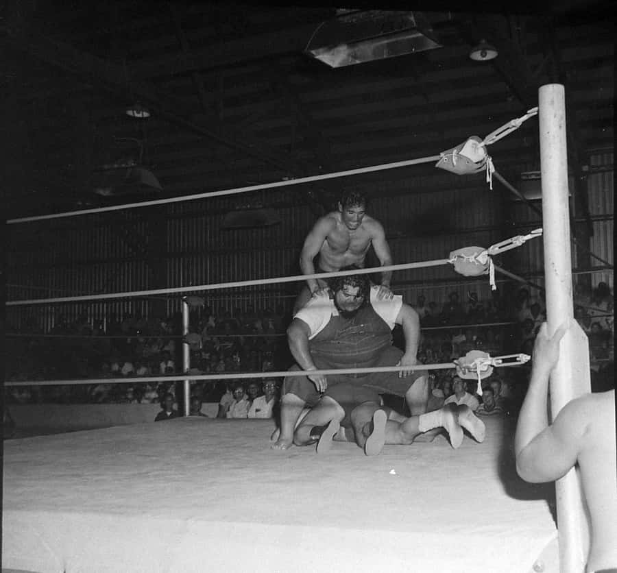 Haystacks Calhoun Facing Off Against Three Wrestlers In A 1963 Match At Fairgrounds Expo Wallpaper