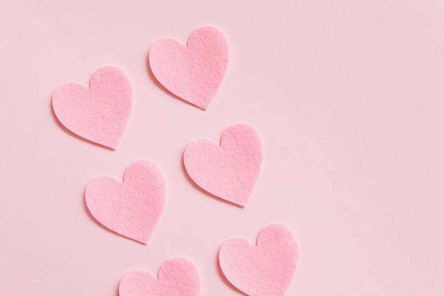 Heart Shaped Cutouts In Soft Ravishing Hues Wallpaper