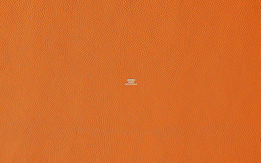 Hermes Logo On Textured Orange Background Wallpaper
