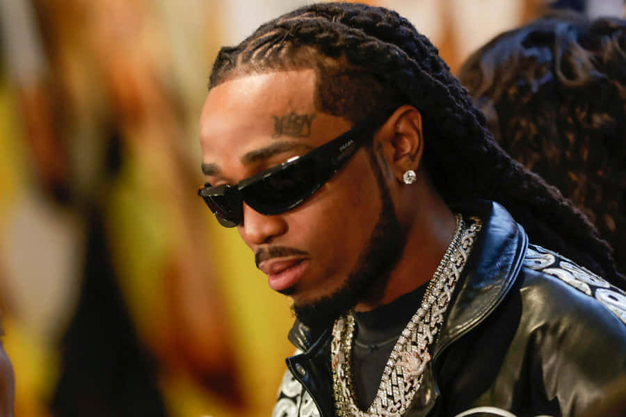 Hip Hop_ Artist_with_ Sunglasses_and_ Chains.jpg Wallpaper