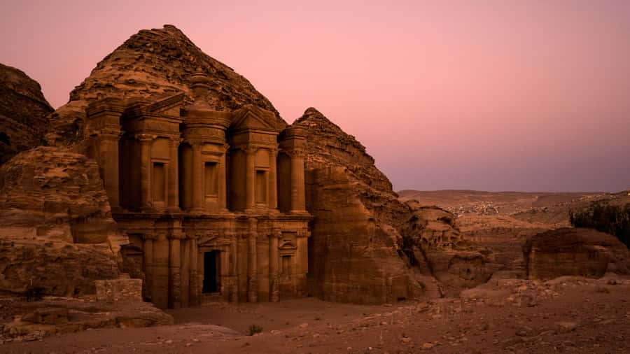 Historical Place Petra Against Pink Skies Wallpaper