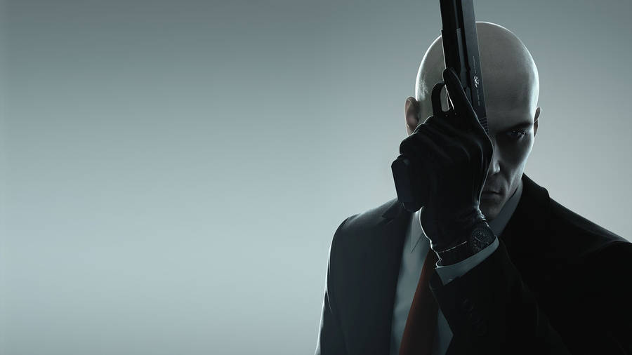 Hitman Hd Raised Gun Wallpaper