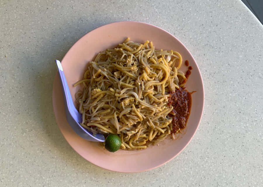 Hokkien Mee Yellow Noodles On Pink Plate Wallpaper