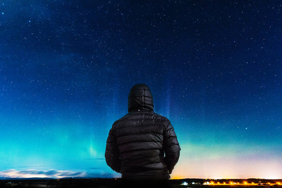 Hooded Guy In Blue Night Sky Wallpaper